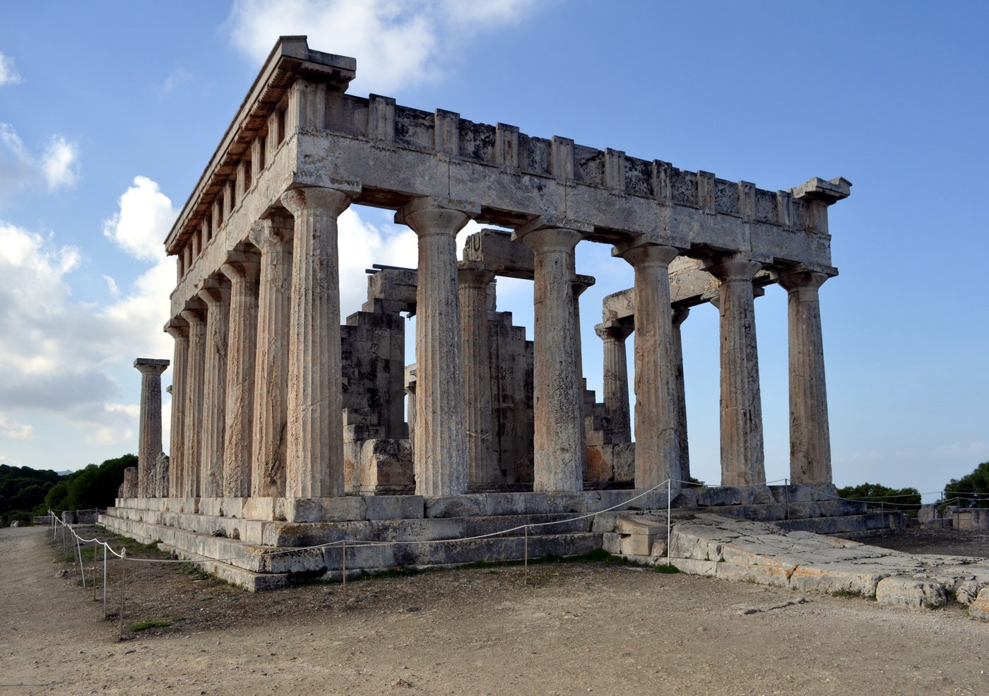 Doric columns of the Temple of Aphaia on a pine-covered hilltop, Aegina island
