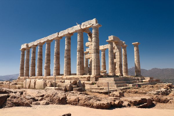 Temple of Poseidon standing on the cliff at Cape Sounion overlooking the Aegean Sea
