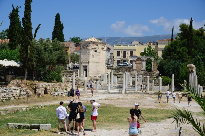 The octagonal Tower of the Winds standing among the ruins of the Roman Agora in Athens