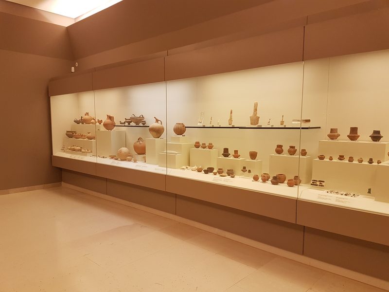 Cases of ancient pottery and small finds on display at the Archaeological Museum of Marathon