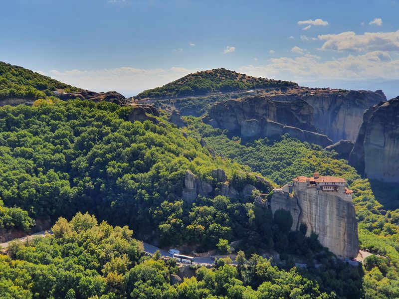 The bare sandstone pillars of Meteora rising above the forest canopy