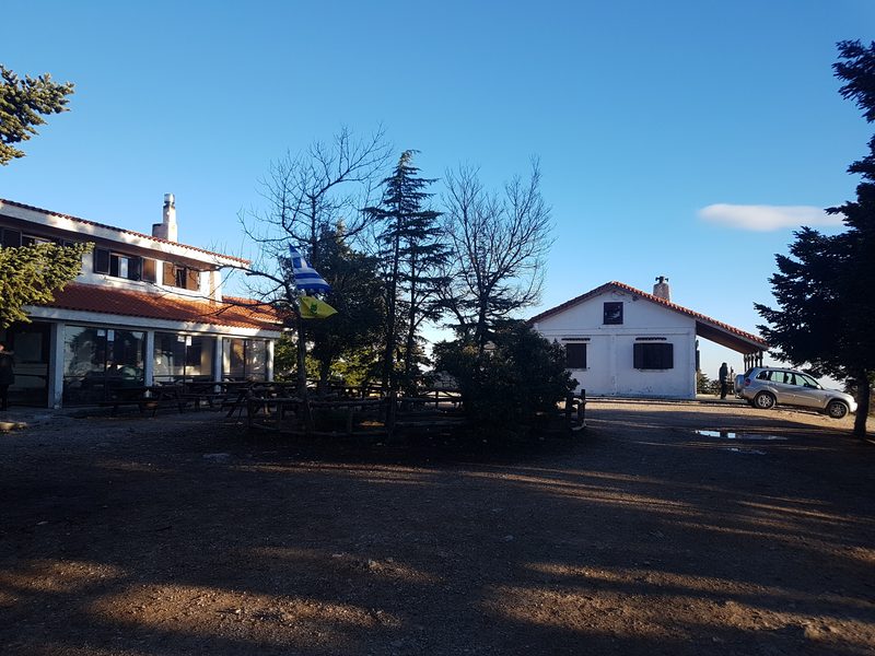Flambouri mountain refuge building surrounded by trees on Mount Parnitha in winter