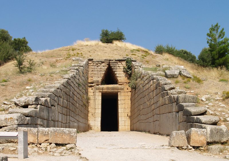 Stone corbelled arch entrance to the Treasury of Atreus tholos tomb at Mycenae archaeological site in Greece