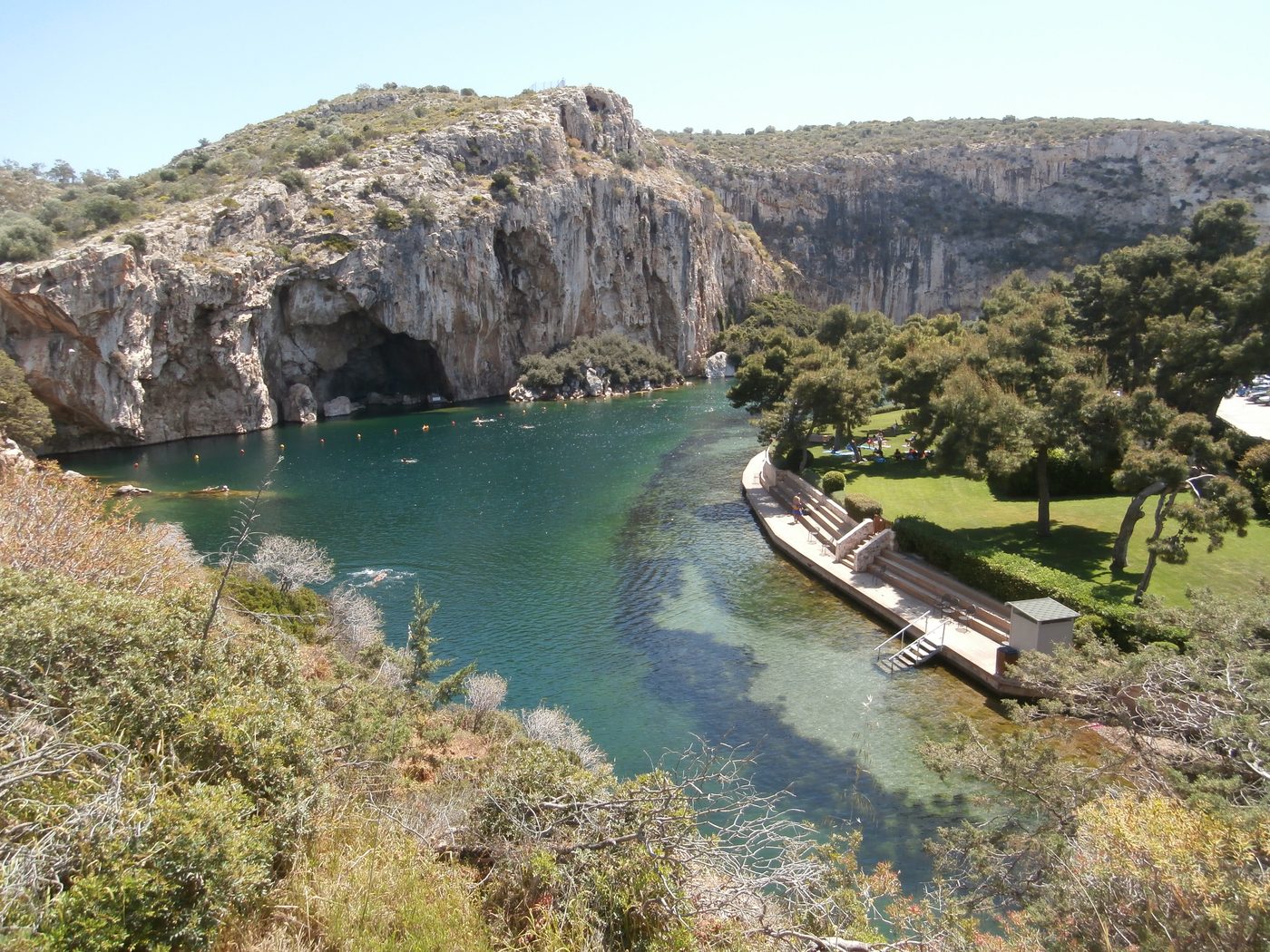 Lake Vouliagmeni warm mineral lake surrounded by cliffs, south of Athens
