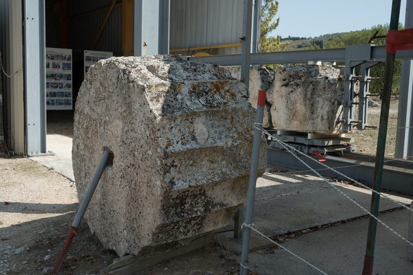 Reconstructed columns of the Temple of Zeus at Ancient Nemea with mountains behind