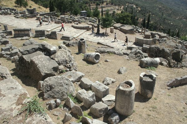 The Sacred Way climbing through the ruins at Delphi with mountain views beyond